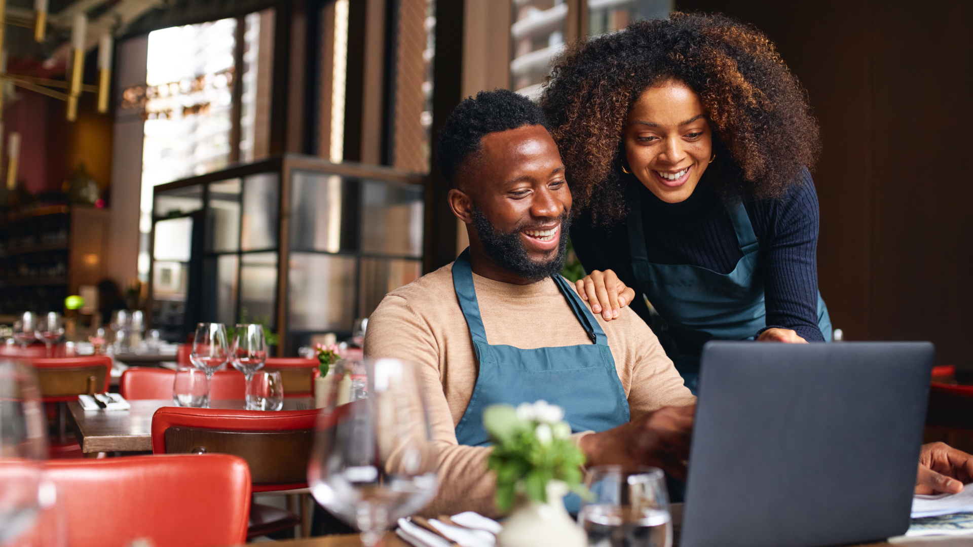 Couple working together in restaurant, bookkeeper