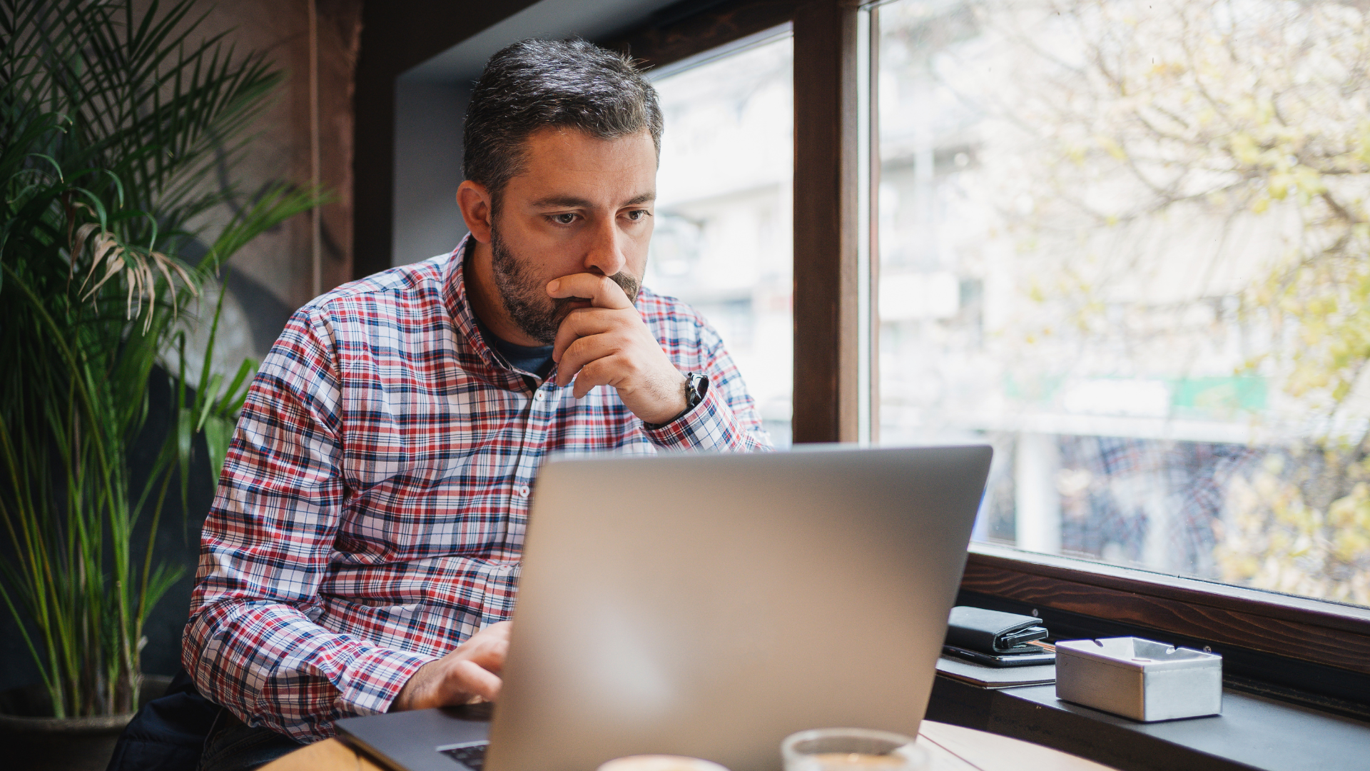 ntario small business owner reviewing a financial budget with an accountant